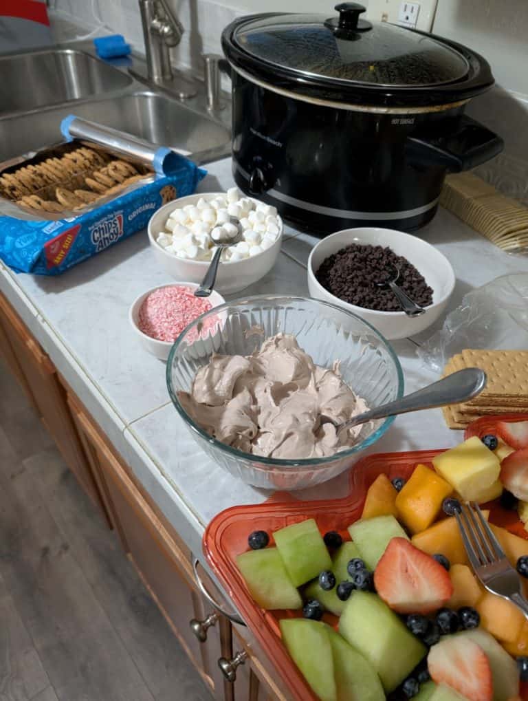 Hot chocolate dip with toppings surrounding it